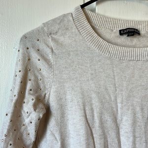 Express cream colored crew neck with gold embellishments. Size small